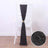 Black decorative table runner with sparkly accents on a chair.
