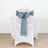 Teal chair sash bow on a white chair at a decorated table