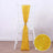 Yellow decorative chair sash with glittery texture, styled on a white chair.