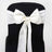 White satin chair bow with rhinestone detail on a black chair. #whtbkgd