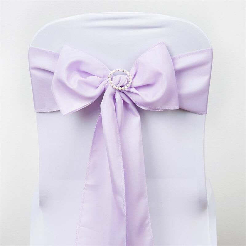 Lavender chair sash with bow and pearl ring detail on a white chair #whtbkgd