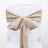 Beige chair sash tied in a bow on a white chair