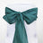 Teal satin chair sash tied in a bow on a white chair. #whtbkgd