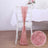 Pink table chair sash with shimmer detail, styled for elegant decor.