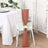 Rustic peach chair sash with flower accent for elegant table settings.