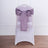 White chair with purple satin bow on a plain background