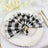 Black and white checkered napkin elegantly folded on a decorative plate.