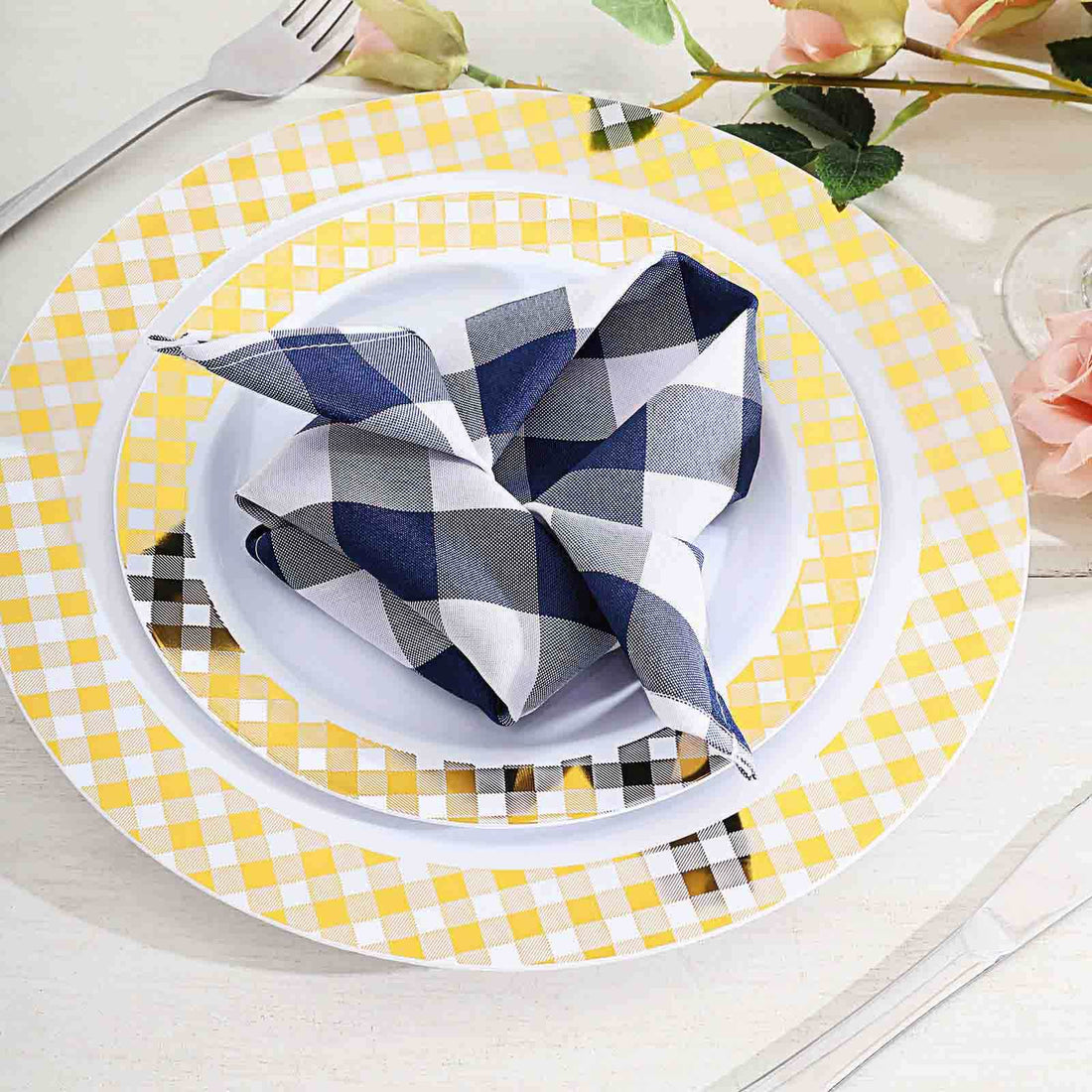 Colorful table setting with patterned plates and napkins.