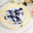 Colorful table setting with patterned plates and napkins.