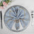 Elegant blue napkin with gold stripes on a decorative plate setting.