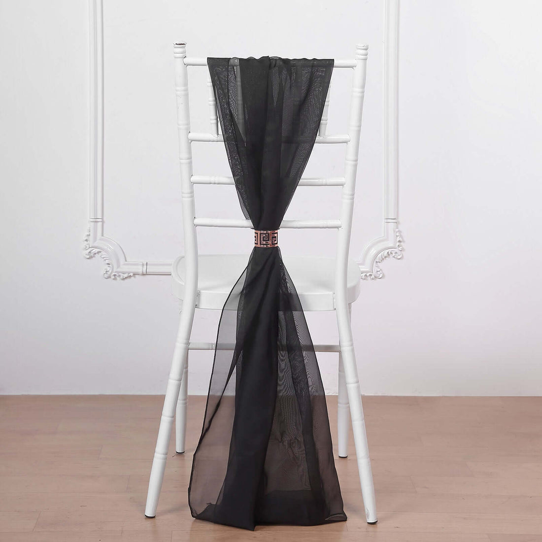 Black sheer chair sash elegantly tied on a white chiavari chair
