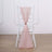 Pink chair sash tied on a white chiavari chair in a minimalist setting.