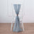 Sheer blue curtain draped over a white chair in a minimalist setting.