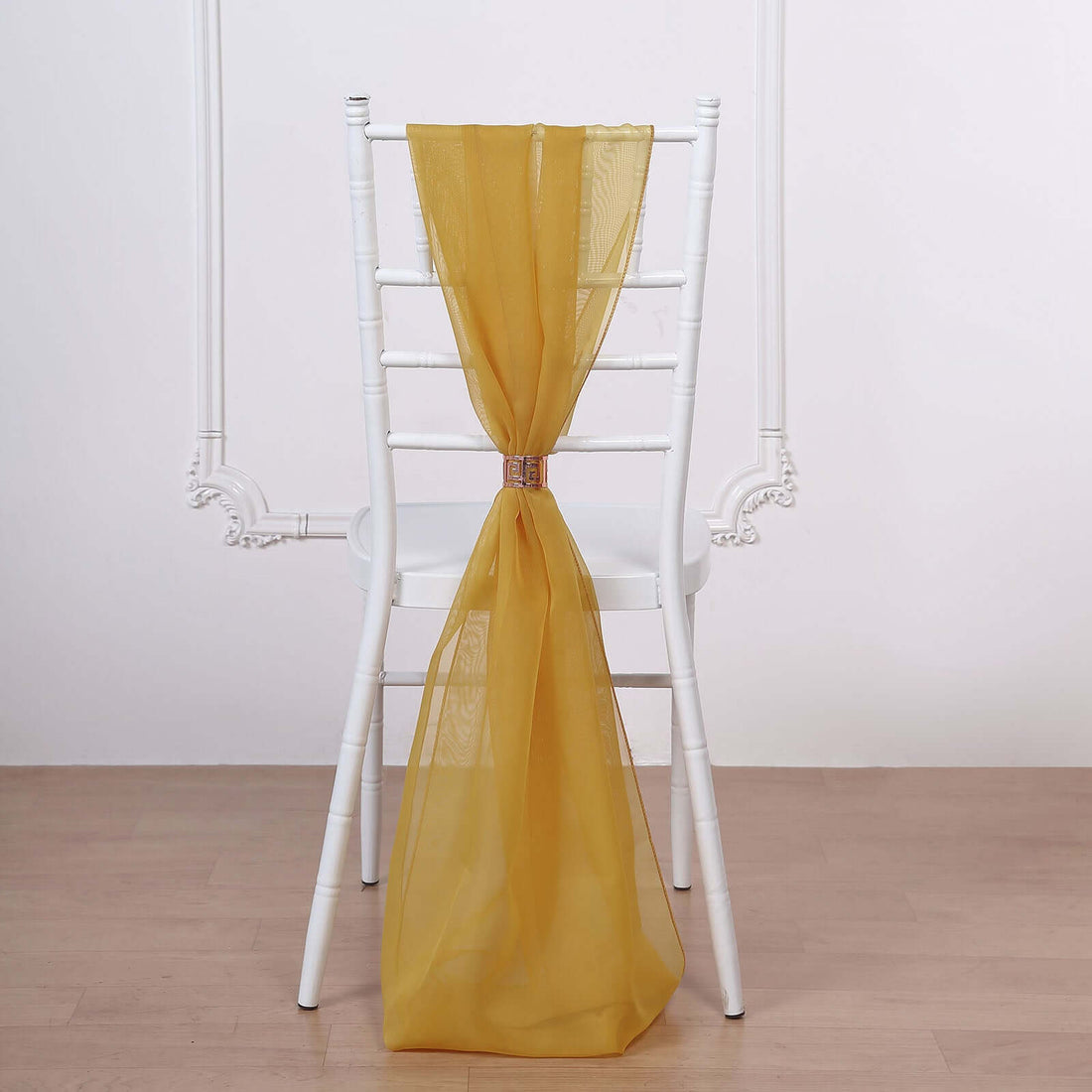 Yellow chair sash draped on a white chair back