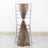 Brown sheer fabric draped on a grey chiavari chair.