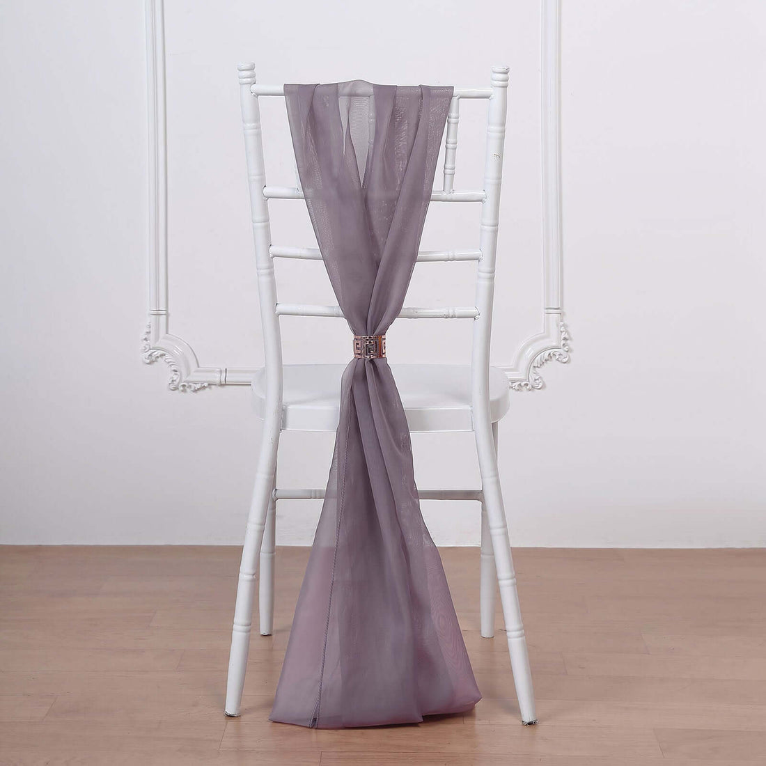 Sheer lavender chair sash draped elegantly on a white chair