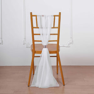White sheer chair sash tied on a wooden chair back against a plain background.