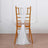 White sheer chair sash tied on a wooden chair back against a plain background.