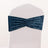 Navy blue velvet chair sash with gathered design on a white chair