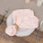 Pink napkin elegantly styled on a decorative plate.