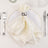 Elegant white satin napkin tied with a silver ring on a white plate.