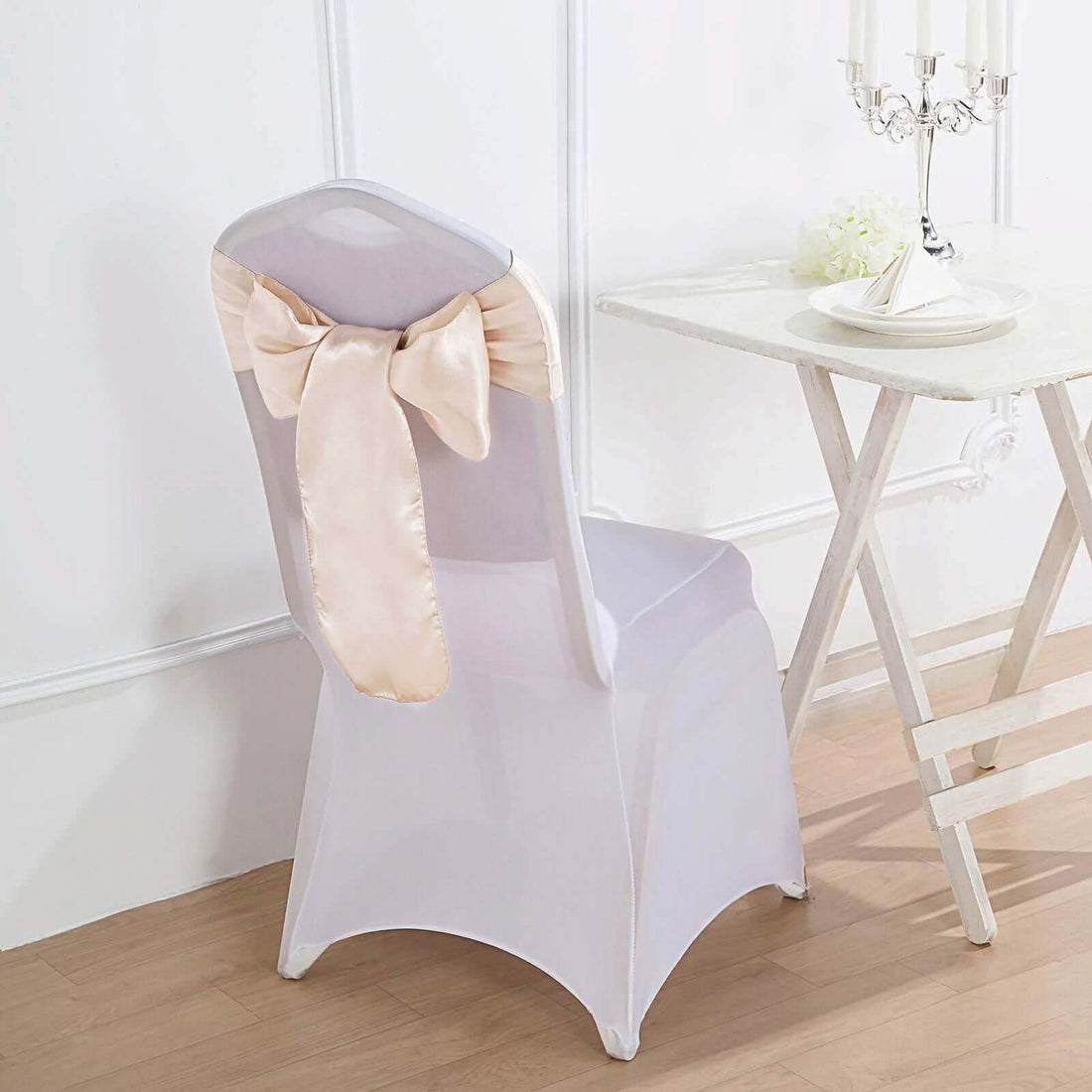 Elegant clear chair with satin bow, perfect for events and weddings.