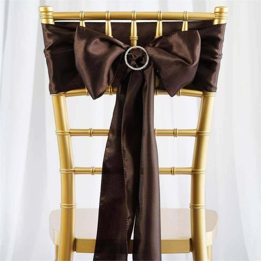 Brown satin chair sash with bow and embellishment for events and weddings.