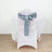 Chair with elegant satin blue bow, perfect for events and weddings.