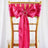 Pink satin chair sash with bow and ring detail on a gold chiavari chair.