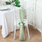 Silk chair sash with rose detail in a styled dining setting.