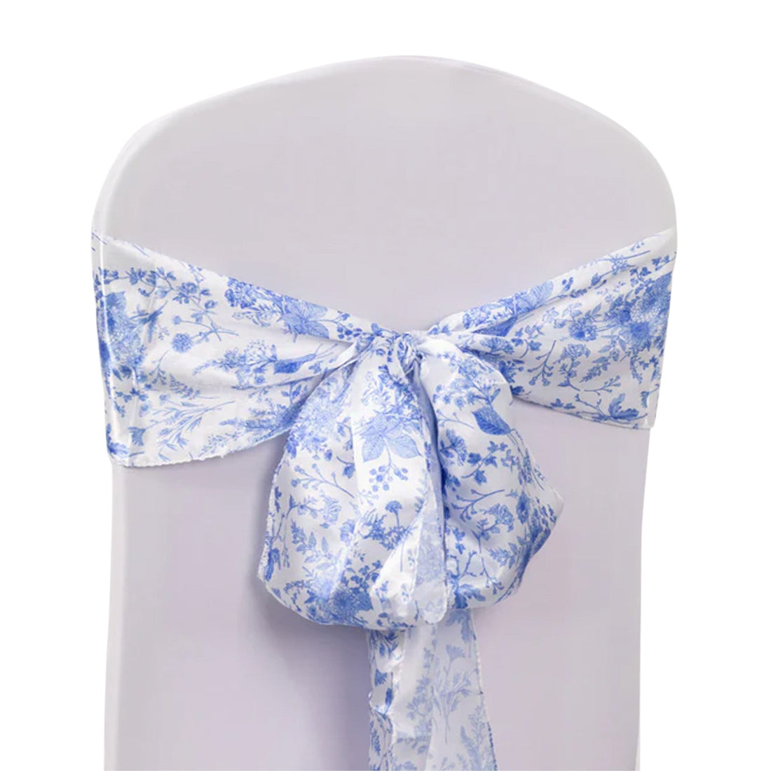 Blue floral chair sash tied on a white chair.