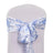 Blue floral chair sash tied on a white chair.