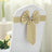 Gold satin chair sash bow on a white wedding chair.