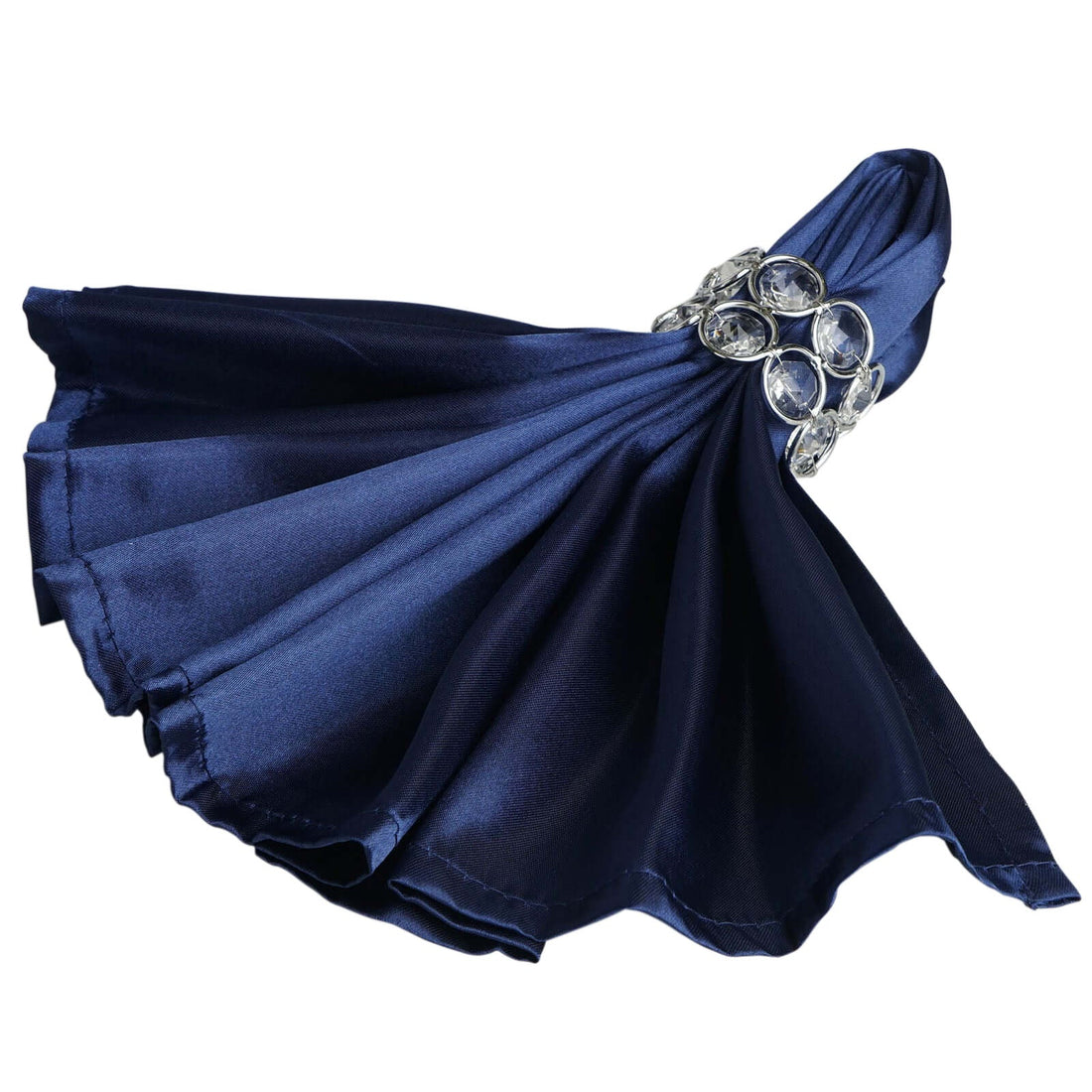 Navy satin napkin with jeweled holder, elegantly draped.