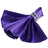 Purple satin napkin with jeweled ring on a white background