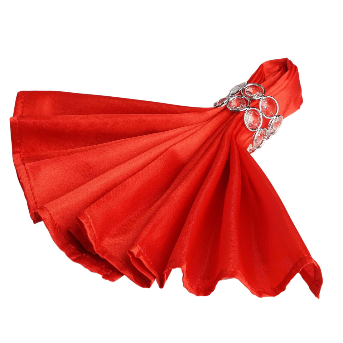 Red silk napkin with decorative silver ring on a white background.