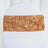 Gold rose-patterned chair sash on a white chair cover.
