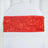 Red satin chair sash with floral design on a white chair.