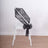 Black lace chair sash tied in a bow on a white chair.