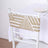 Gold-patterned chair back cover on a white chair against a plain backdrop.