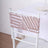 Decorative chair back cover with geometric design in pink and white