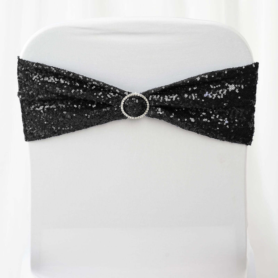 Black sequin chair sash with a decorative rhinestone buckle
