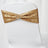 Gold sequin chair sash with a circular rhinestone buckle.