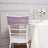 Pink sequin chair cover on a white dining chair in a decorated setting.