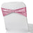 Pink sequin chair cover with a decorative ring, elegant event decor.