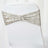 Silver sequin chair cover with bow detail for elegant decor.