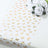 Gold butterfly patterned table runner on a white background.