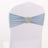 Blue chair sash with gold embellishment on a white backdrop