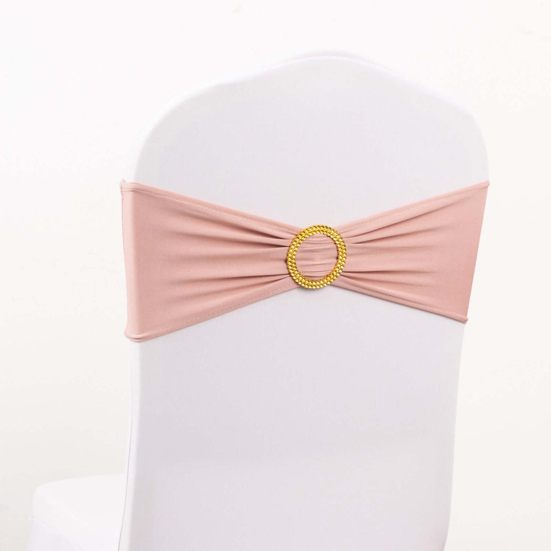 Pink chair sash with decorative gold ring for event decor