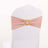 Pink chair sash with decorative gold ring for event decor